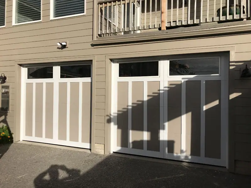 After: carriage-style garage doors on a duplex