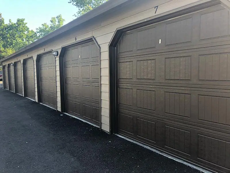 After: new garage doors on the row of garages