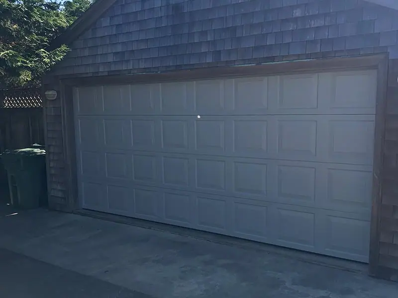 After: new raised-panel garage door