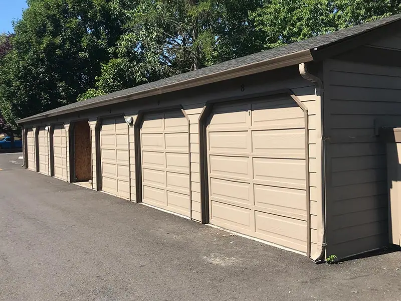 Before: faded garage doors on a row of garages