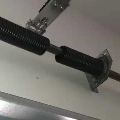 Broken garage door torsion spring
