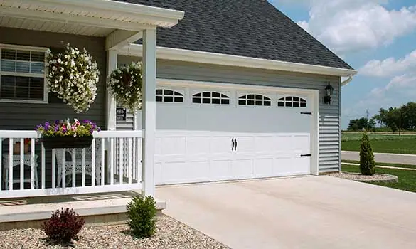 White garage door with windows on a farmhouse