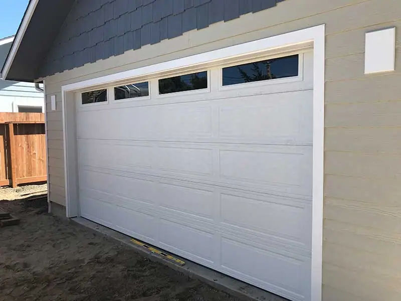 New white garage door with windows, installed