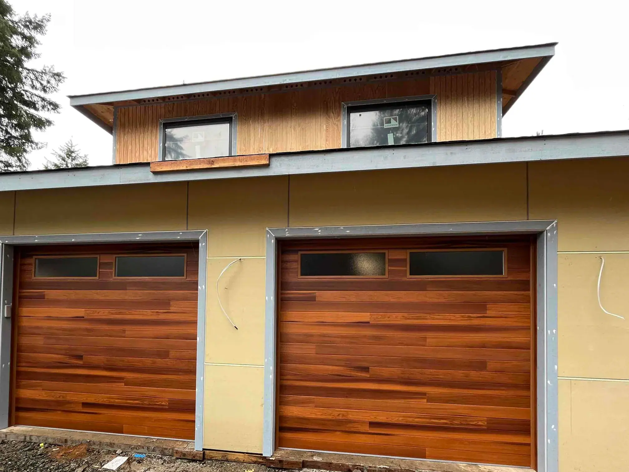 Wood-look garage doors on a modern home